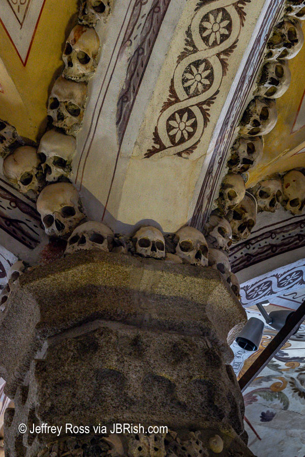 Skulls embedded in the arch of a support column